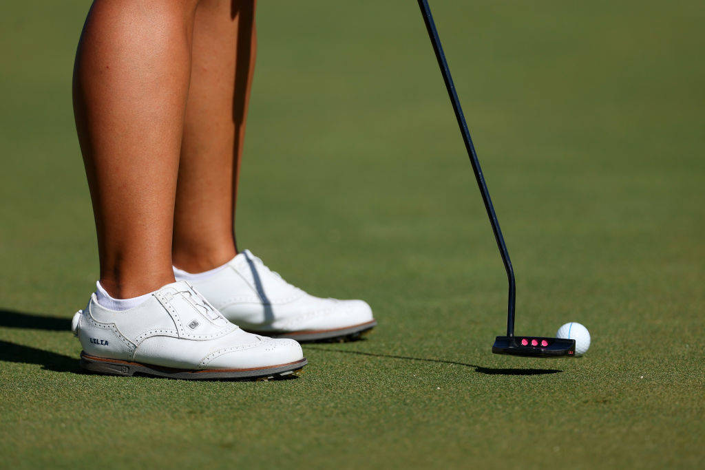 A close up of Lilia Vu putting